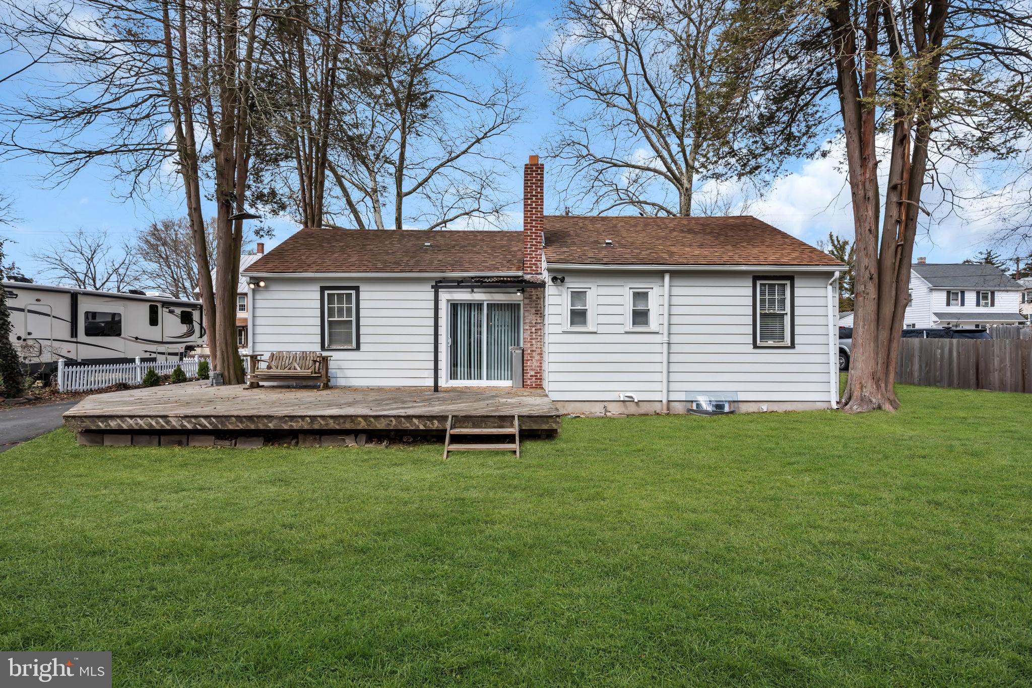 116 Hough Street Pemberton, NJ 08068 - Photo 23 of 25 a front view of a house with a garden and deck