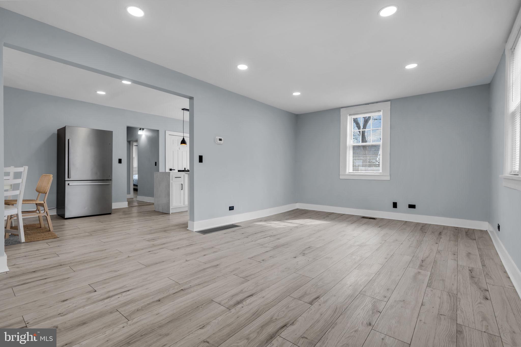 116 Hough Street Pemberton, NJ 08068 - Photo 4 of 25 a view of a big room with wooden floor and a window