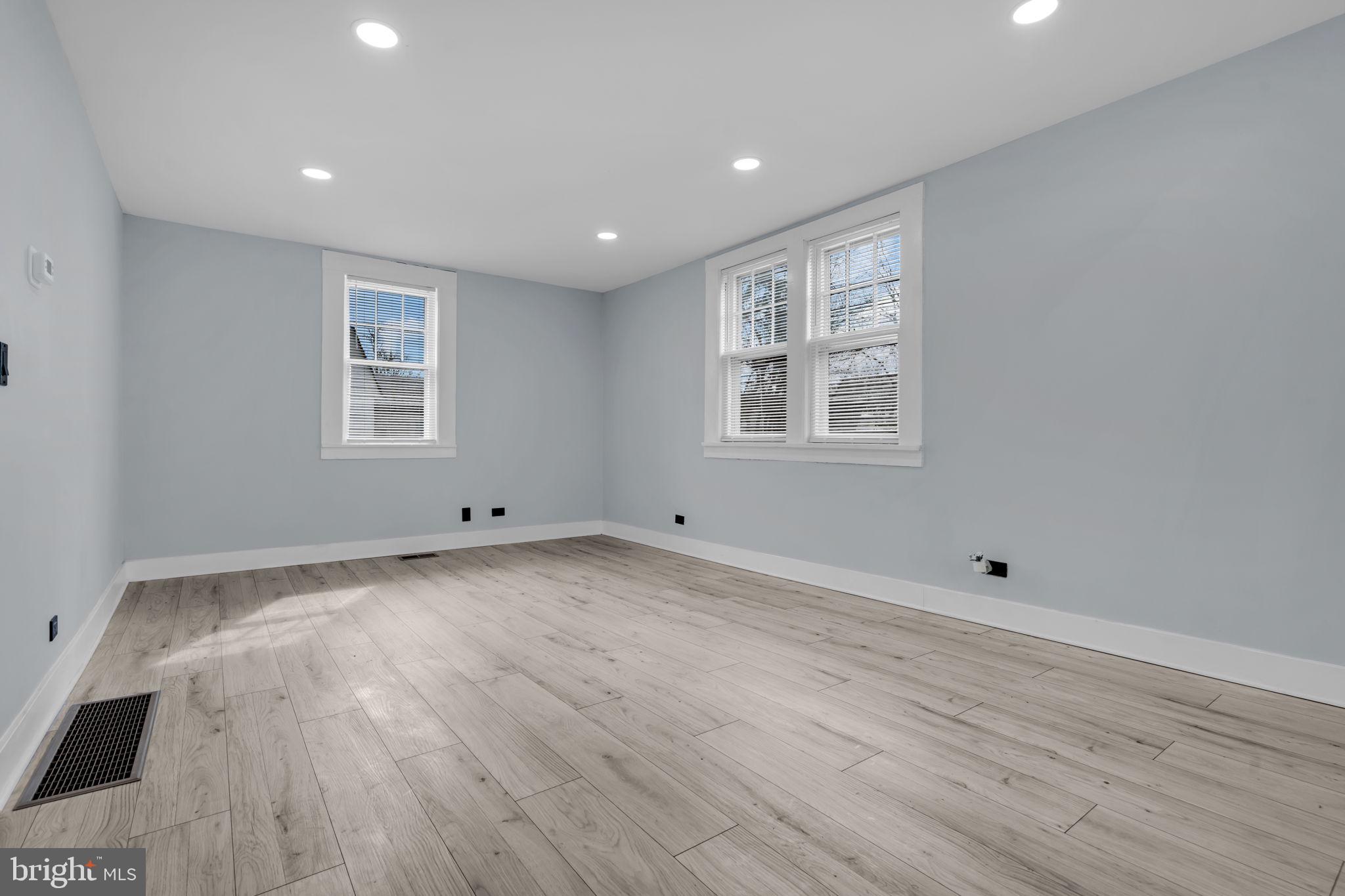 116 Hough Street Pemberton, NJ 08068 - Photo 5 of 25 a view of an empty room with wooden floor and a window