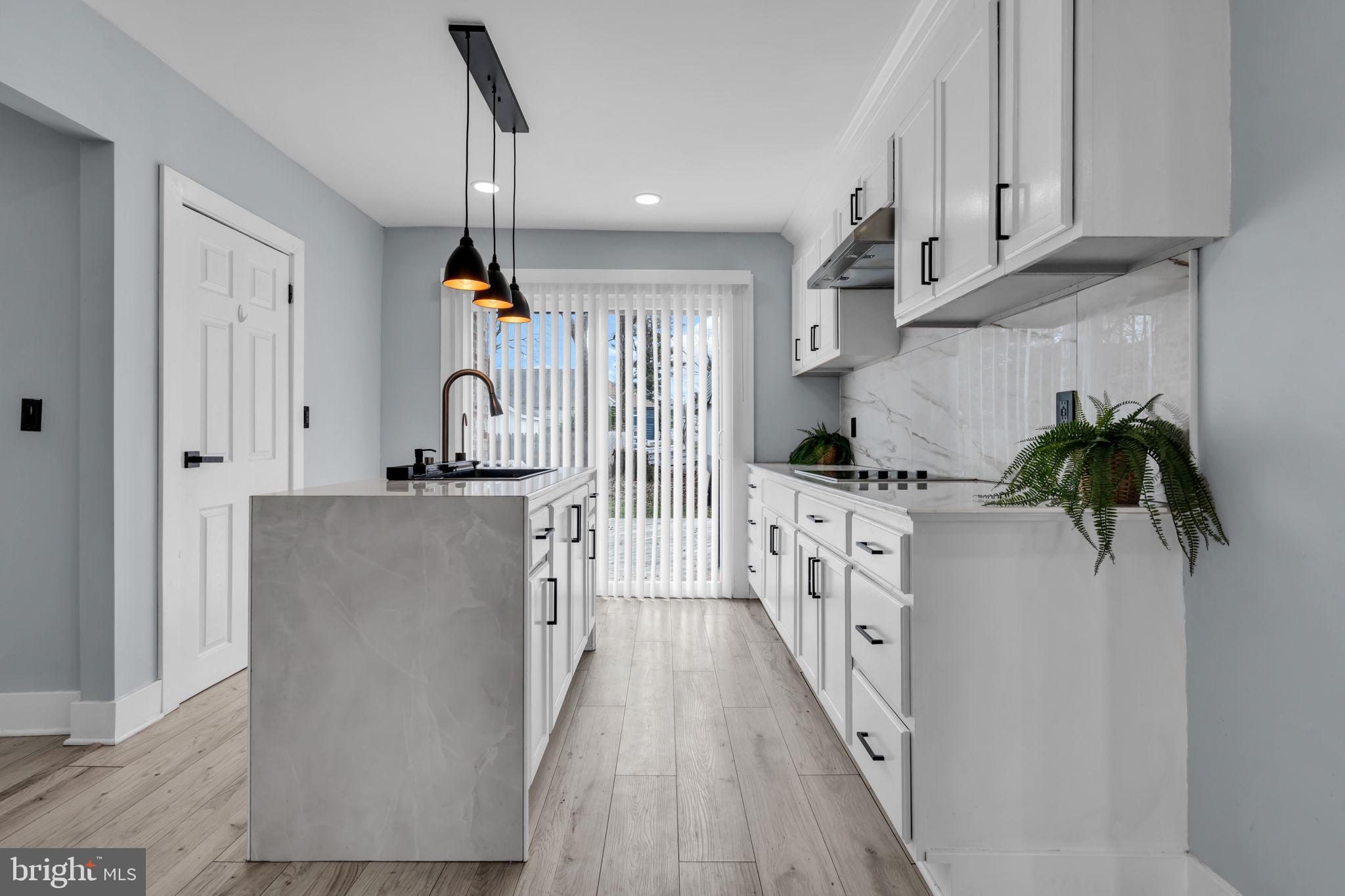 116 Hough Street Pemberton, NJ 08068 - Photo 8 of 25 a kitchen with white cabinets and appliances