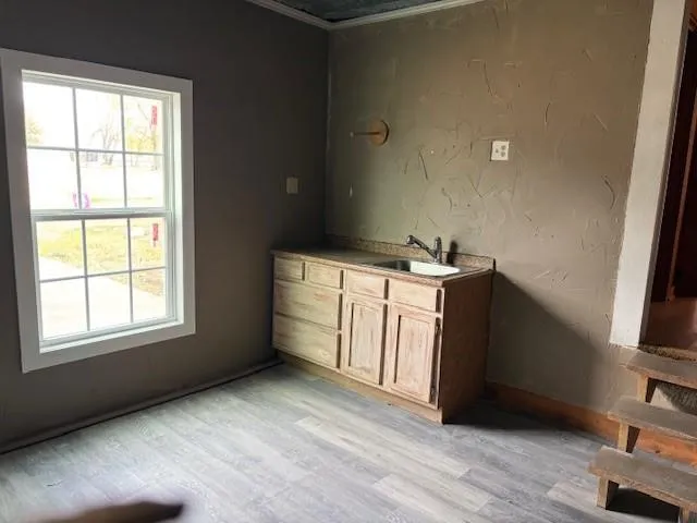 a view of a kitchen with a sink dishwasher and a refrigerator