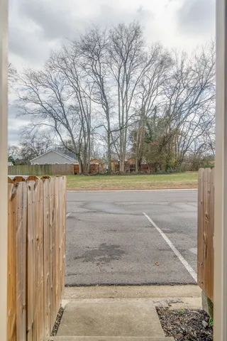 a view of a yard with large trees