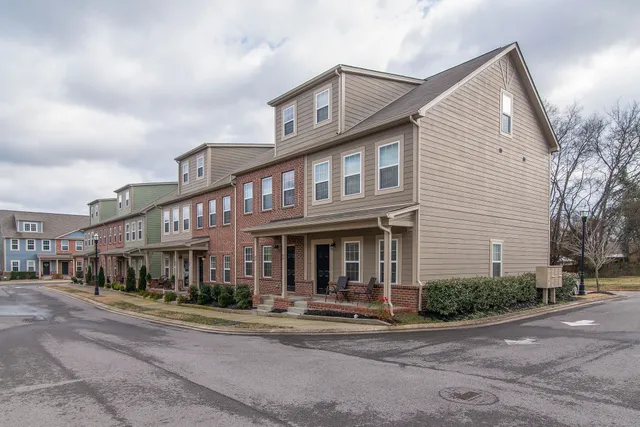 a front view of a house with small garden