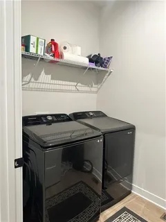 a room with furniture and white walls