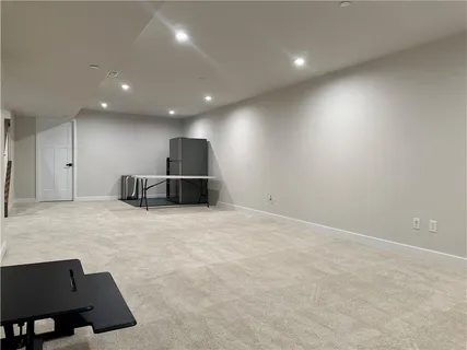 a bedroom with a bed and a desk