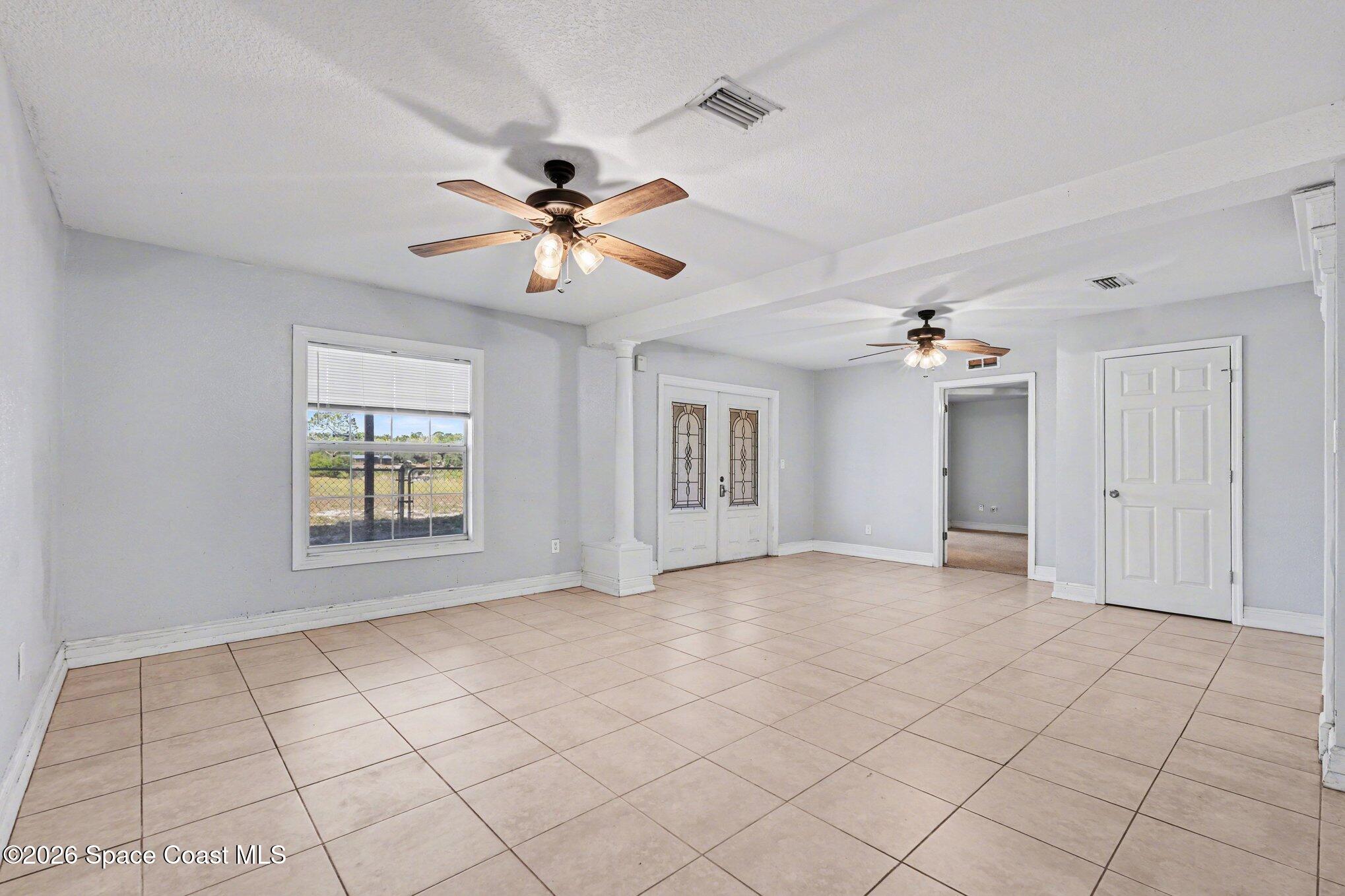4950 Blounts Ridge Road Mims, FL 32754 - Photo 4 of 40 a view of an empty room with a window