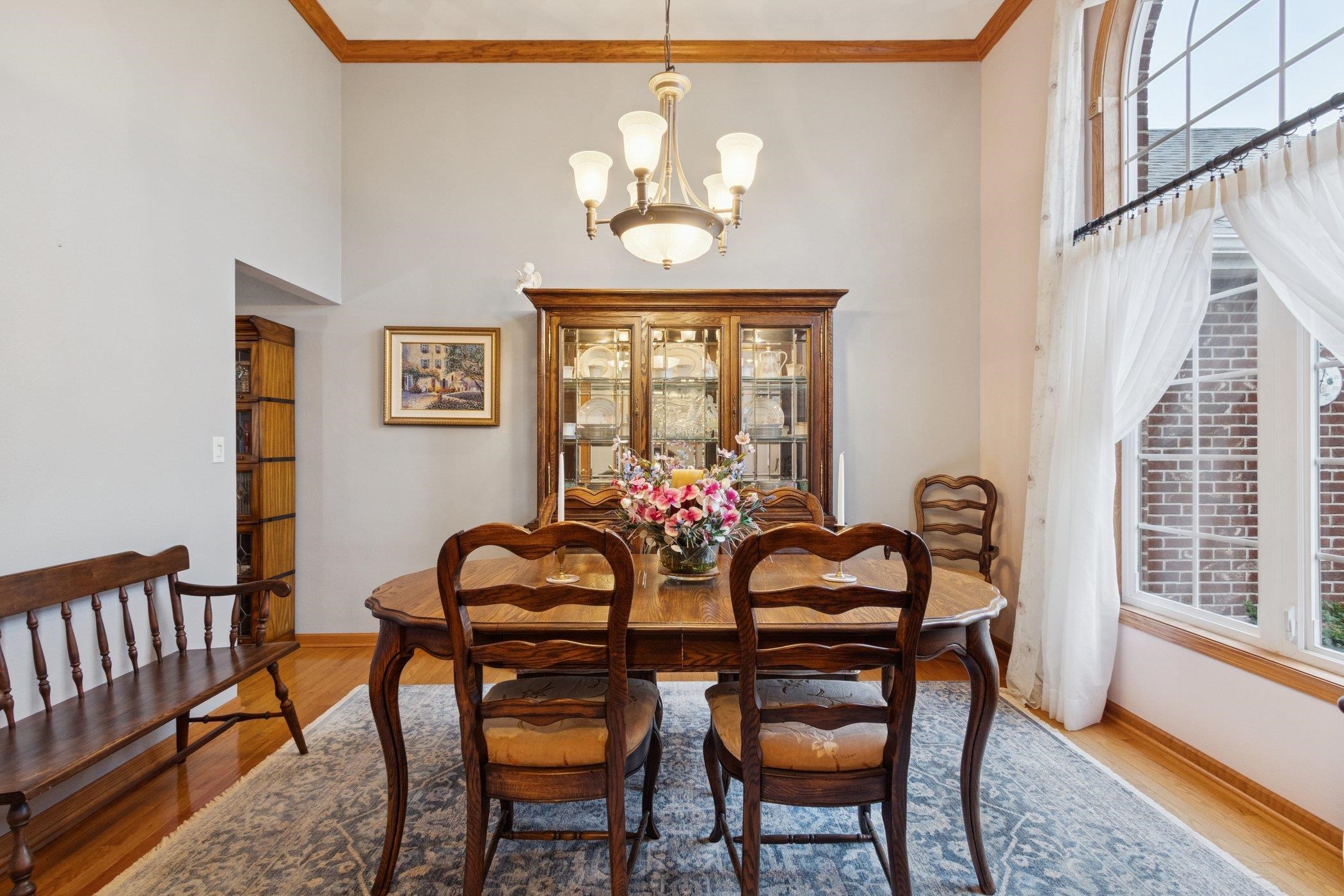638 Merrion Road Roscoe, IL 61073 - Photo 55 of 64 a view of a dining room with furniture and chandelier