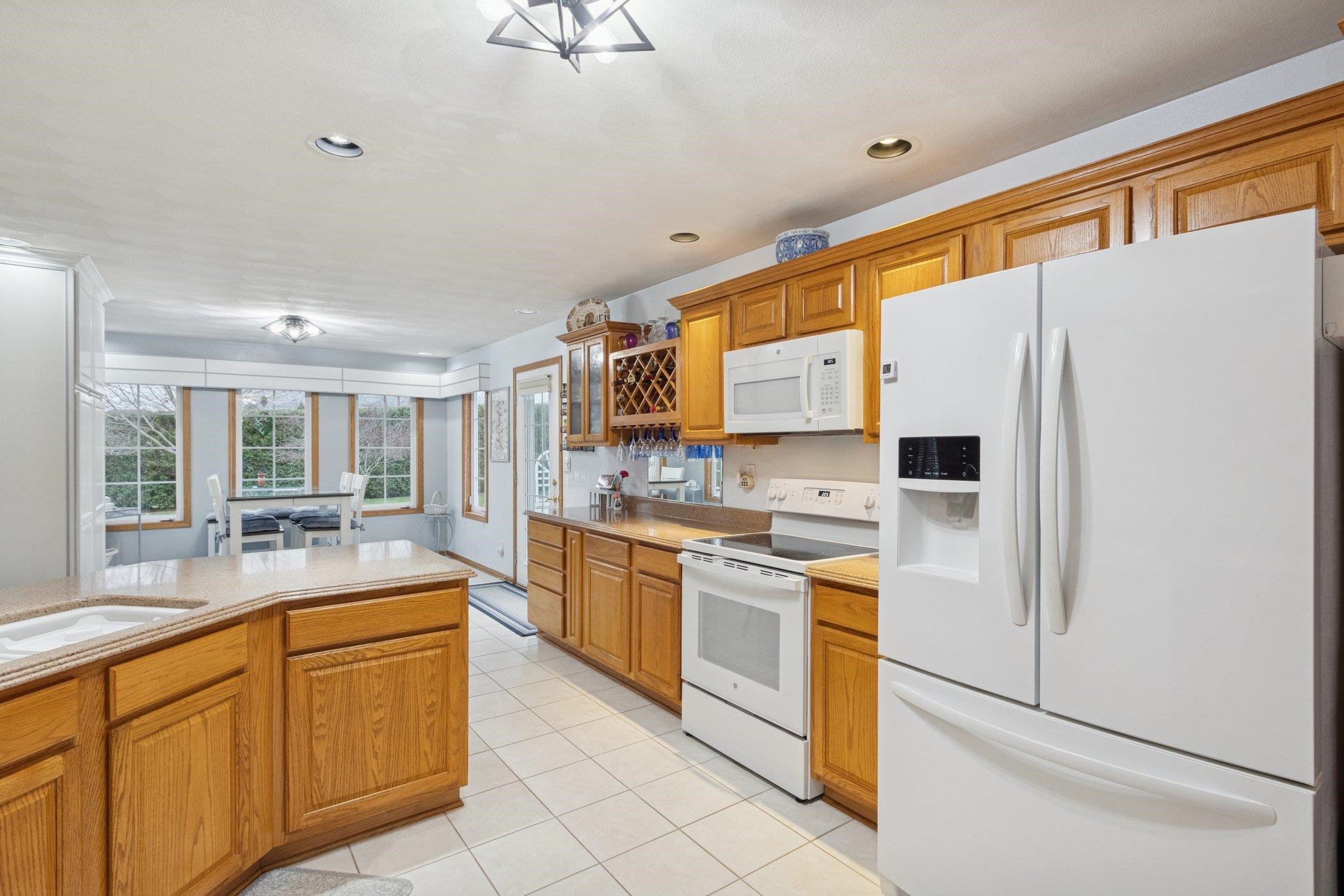 638 Merrion Road Roscoe, IL 61073 - Photo 7 of 64 a kitchen with stainless steel appliances a refrigerator sink and cabinets