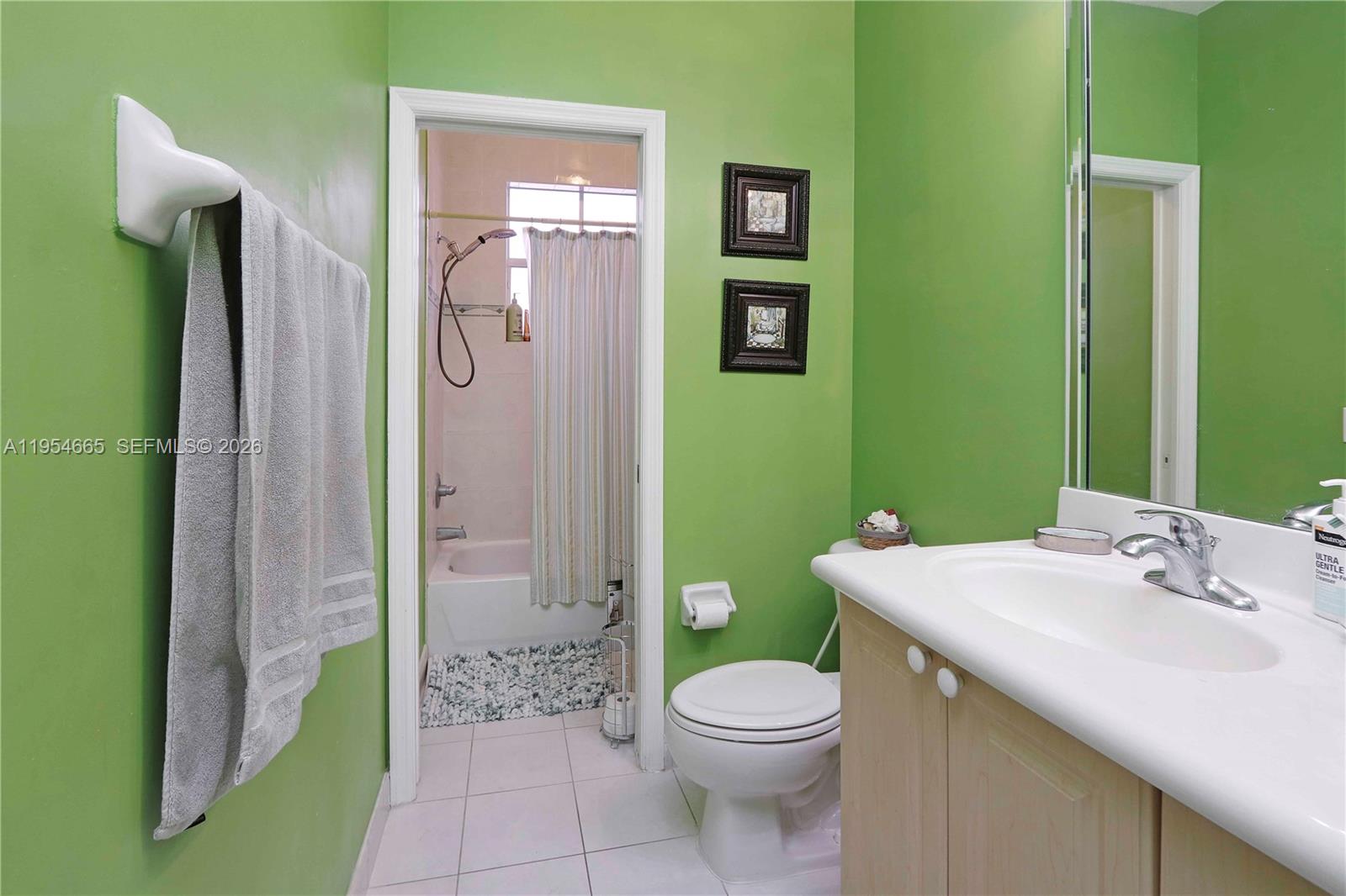 15382 Southwest 16th Terrace Miami, FL 33185 - Photo 13 of 26 a bathroom with a sink a toilet and shower