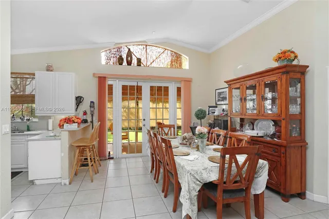 a view of a dining room with furniture window and outside view