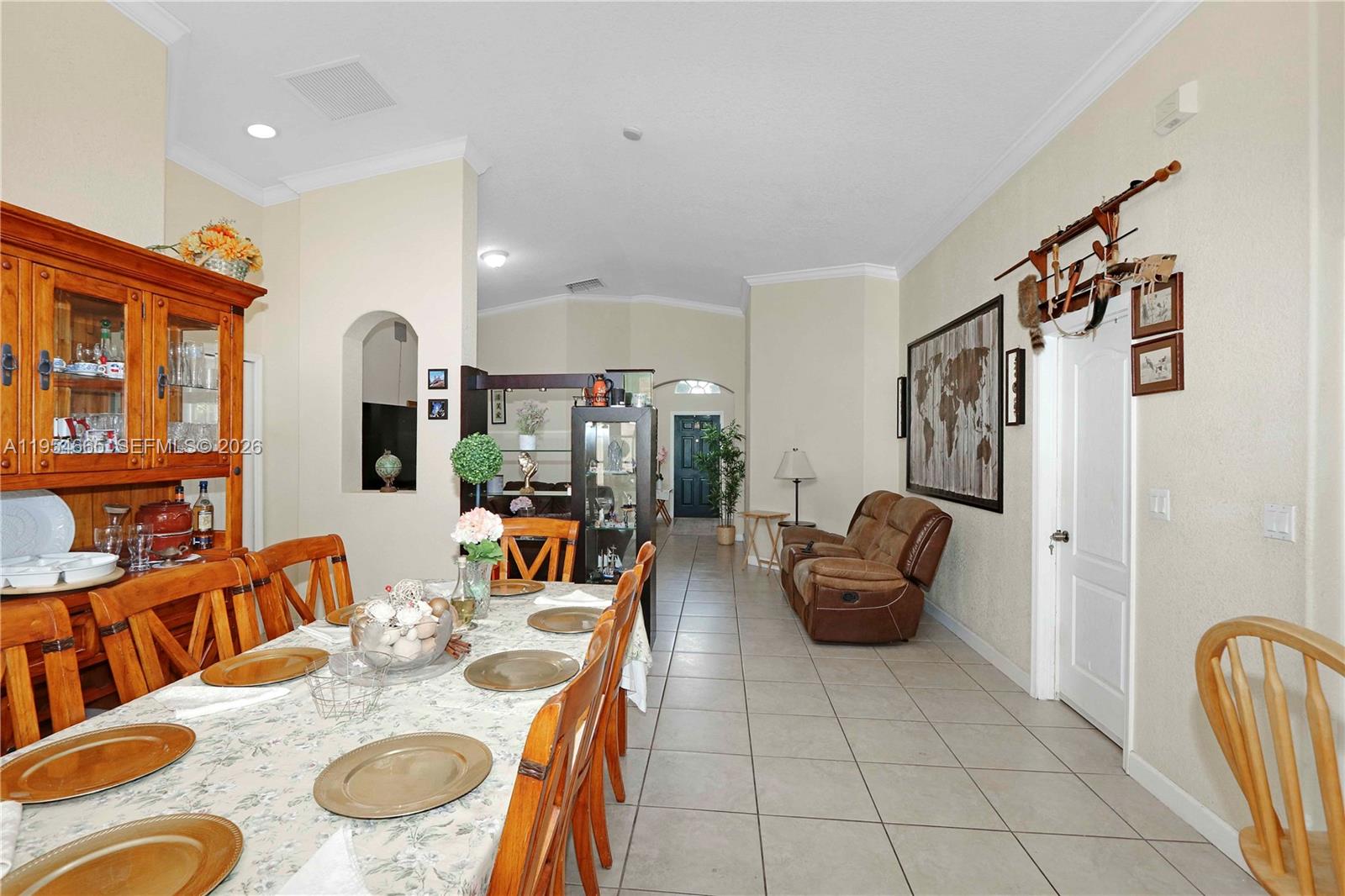 15382 Southwest 16th Terrace Miami, FL 33185 - Photo 6 of 26 a dining room with furniture and wooden floor