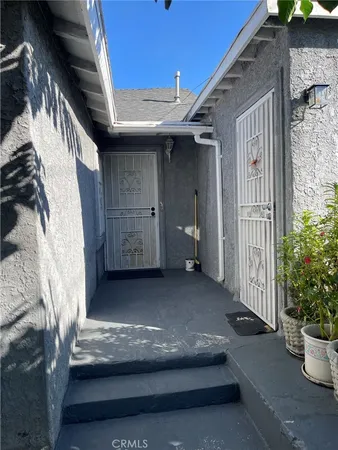 a view of a wrought iron fences in front of house