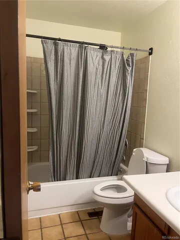 a view of a hallway with wooden floor and stairs