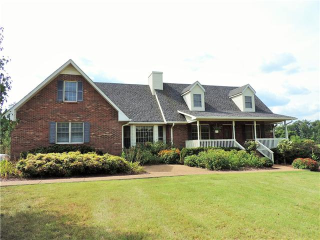 2920 Sweethome Road Chapmansboro, TN 37035 - Photo 1 of 20 Brick Cape Cod located on gently rolling 10+ acres.