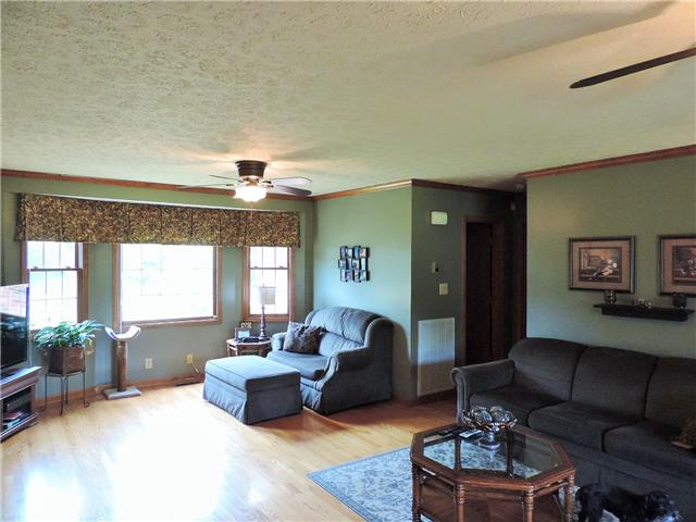 2920 Sweethome Road Chapmansboro, TN 37035 - Photo 5 of 20 Short hall off of living room leads to 1/2 bath, owners bedroom/bath and door to basement.