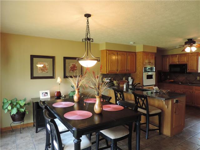 2920 Sweethome Road Chapmansboro, TN 37035 - Photo 6 of 20 Dining room is open to kitchen with large bay window overlooking beautiful front landscape.