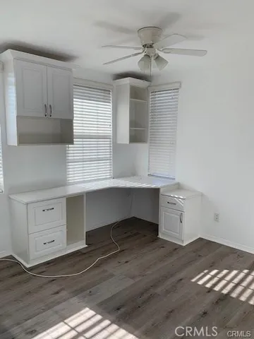 a room with cabinet and mirrors