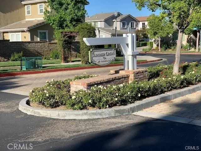 a front view of a house with a yard and a garage