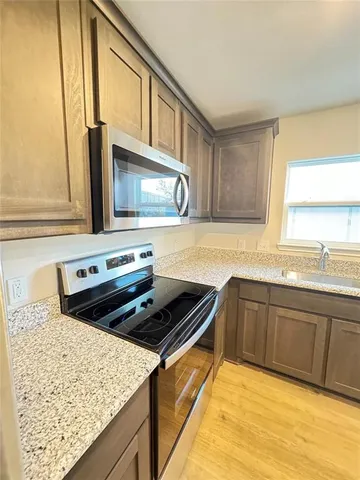 a kitchen with a stove and a sink