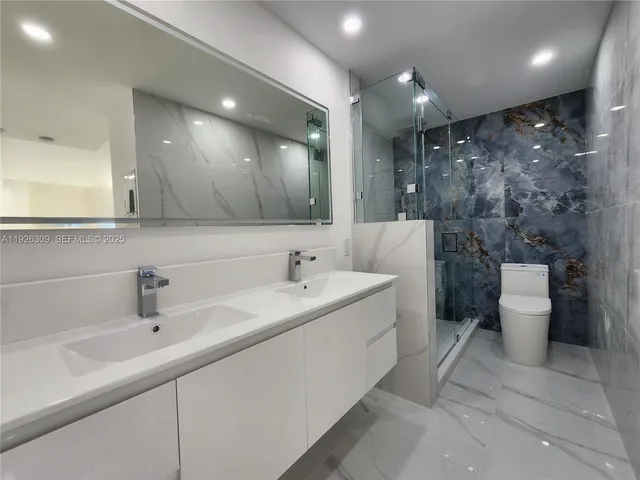 a bathroom with a shower and toilet
