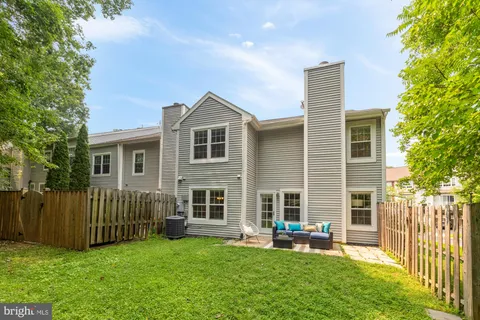 a front view of a house with a yard and porch