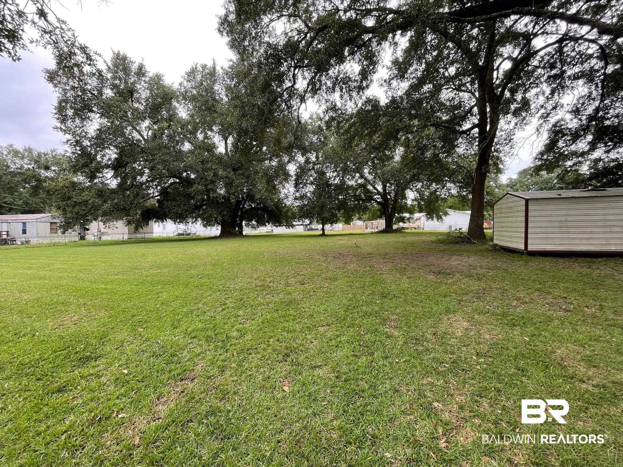 15338 Windbigler Drive Foley, AL 36535 - Photo 24 of 28 View of yard with a storage shed