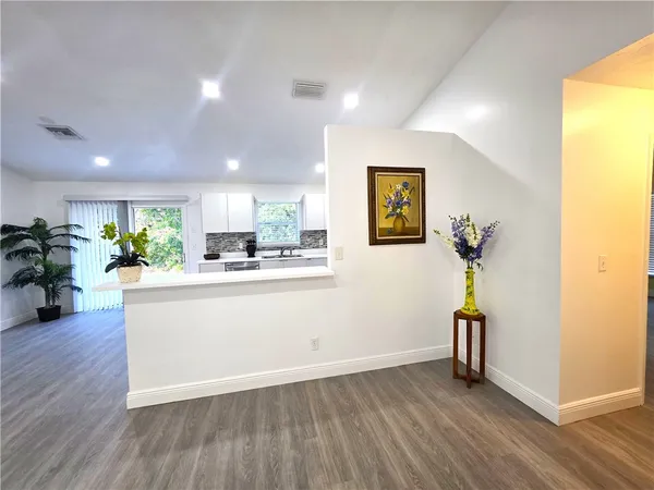 a view of a living room and a wooden floor