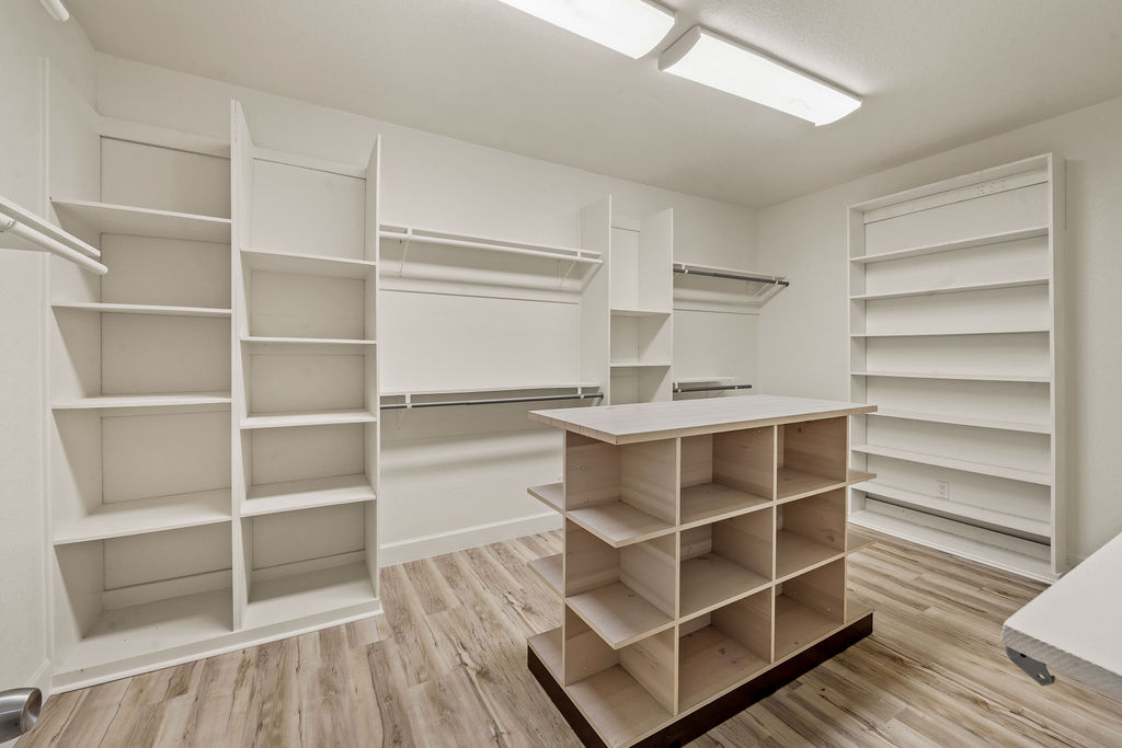 2795 Highway 290 Dripping Springs, TX 78620 - Photo 16 of 40 a view of walk in closet with empty racks