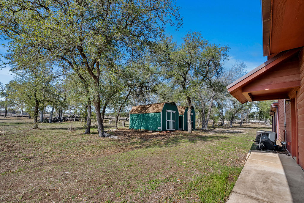 2795 Highway 290 Dripping Springs, TX 78620 - Photo 27 of 40 a front view of a building with trees