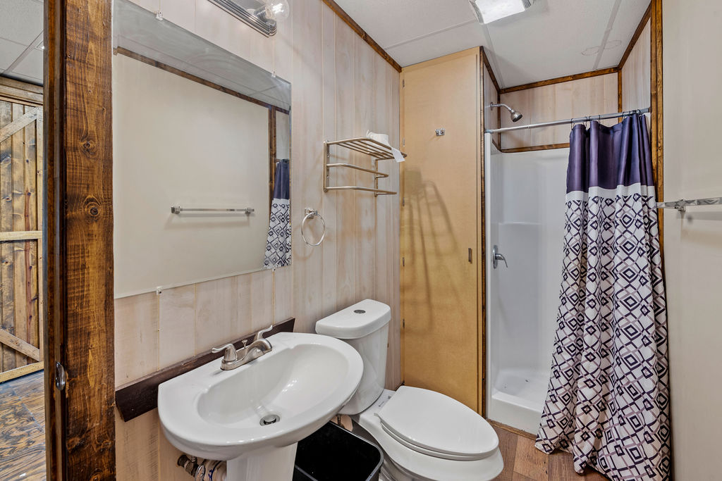 2795 Highway 290 Dripping Springs, TX 78620 - Photo 31 of 40 a bathroom with a sink toilet and shower