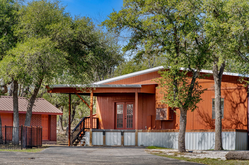 2795 Highway 290 Dripping Springs, TX 78620 - Photo 37 of 40 a front view of a house with garden