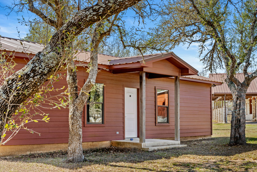 2795 Highway 290 Dripping Springs, TX 78620 - Photo 38 of 40 a front view of a house with a tree