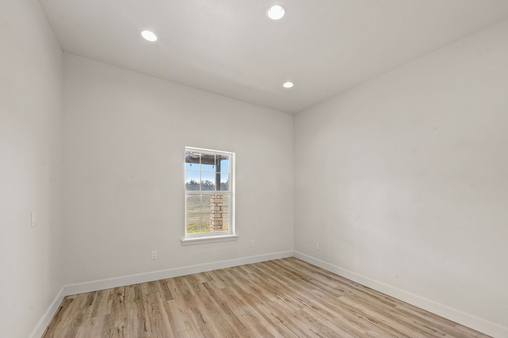 2795 Highway 290 Dripping Springs, TX 78620 - Photo 8 of 40 an empty room with a window