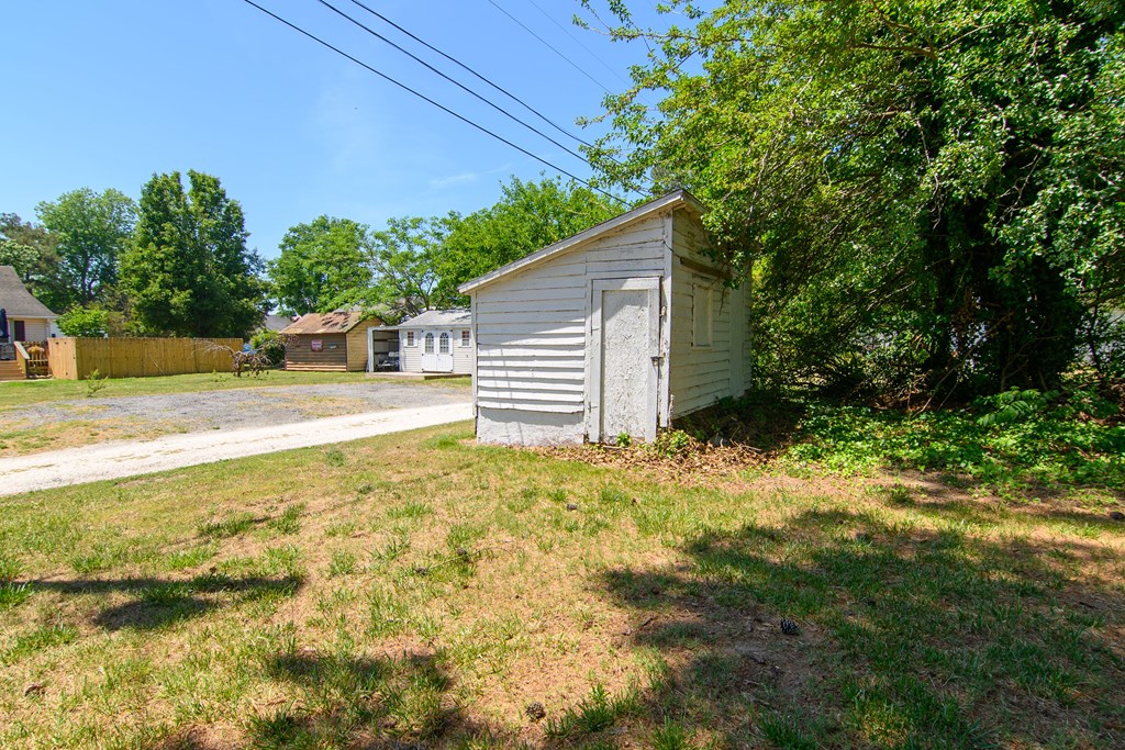 24432 Maxwell Street Parksley, VA 23421 - Photo 31 of 39 a view of a house with a yard and garage