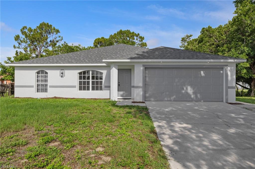 18396 Heather Road Fort Myers, FL 33967 - Photo 1 of 26 front view of a house with a yard