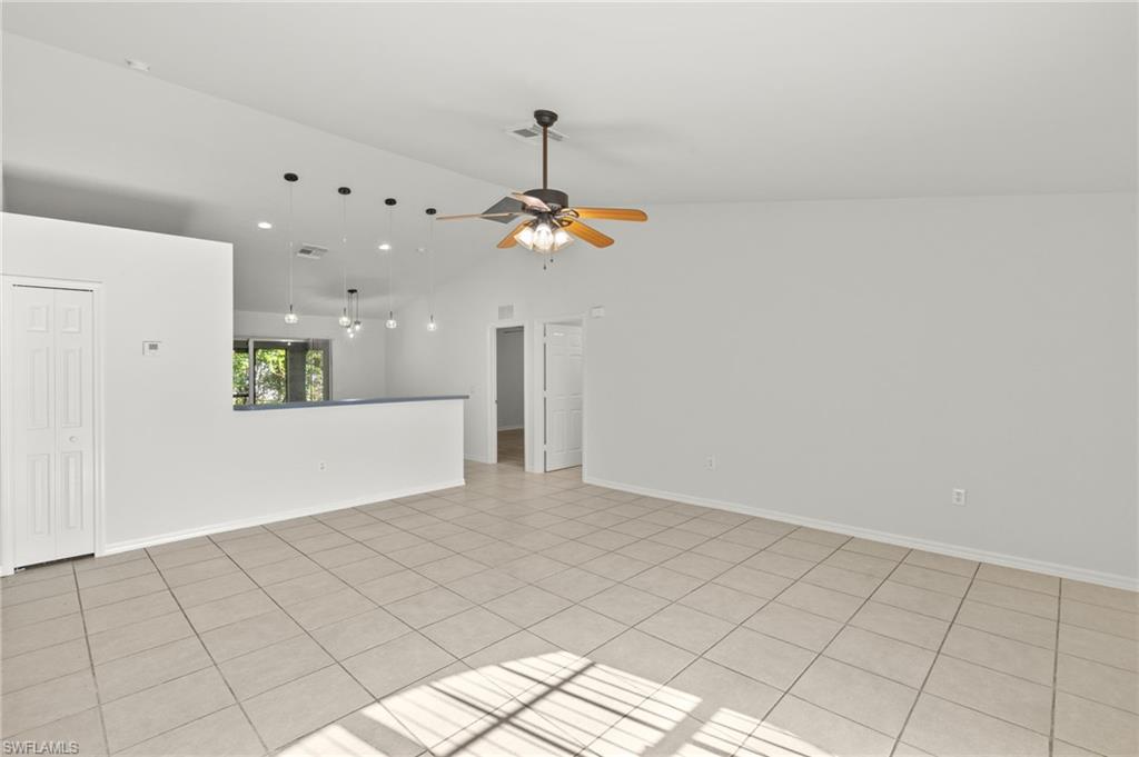 18396 Heather Road Fort Myers, FL 33967 - Photo 3 of 26 a view of a kitchen with a dishwasher and a refrigerator with white cabinets