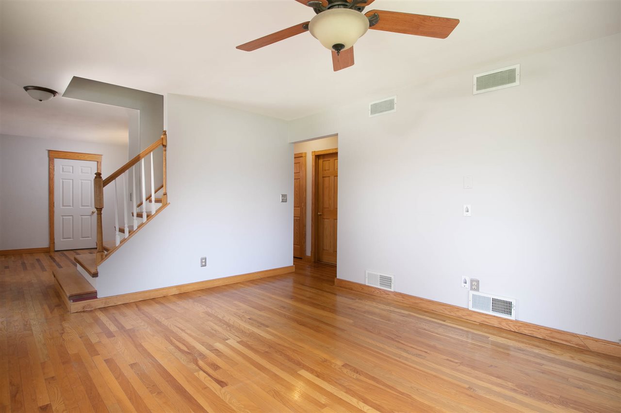 2893 Karr Road Belvidere, IL 61008 - Photo 11 of 25 a view of an empty room with wooden floor