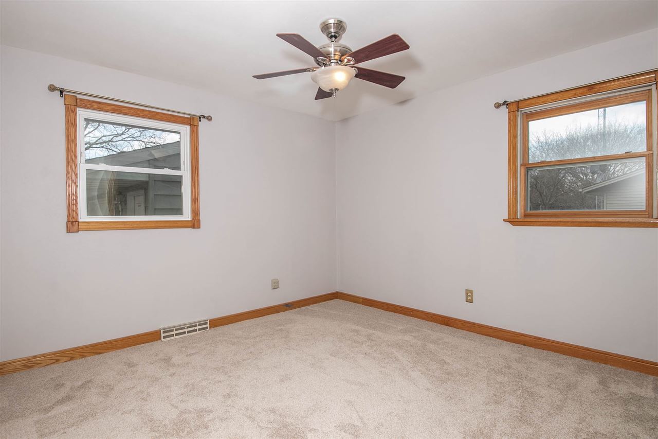 2893 Karr Road Belvidere, IL 61008 - Photo 12 of 25 an empty room with a window and a fan