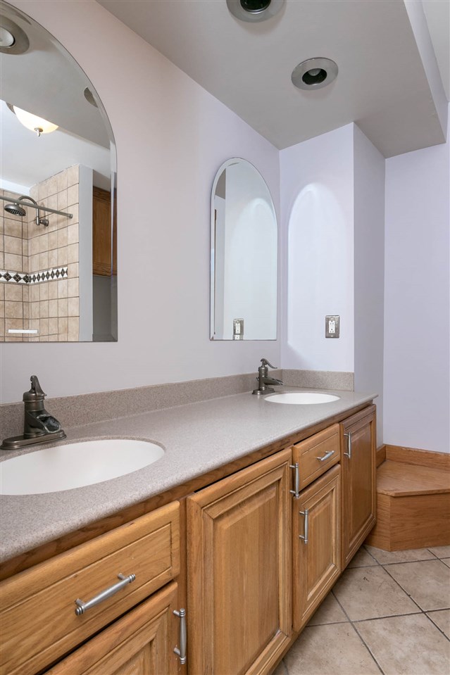2893 Karr Road Belvidere, IL 61008 - Photo 13 of 25 a bathroom with a granite countertop sink a large mirror and