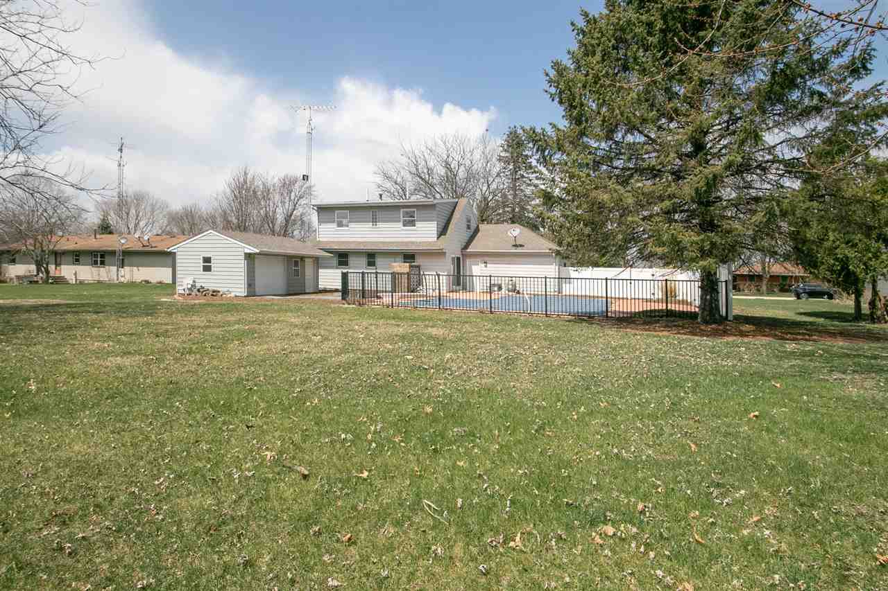 2893 Karr Road Belvidere, IL 61008 - Photo 23 of 25 a view of a house with a big yard and a large tree