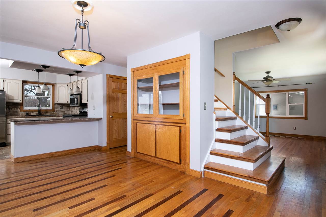 2893 Karr Road Belvidere, IL 61008 - Photo 3 of 25 a view of a room with wooden floor and white walls