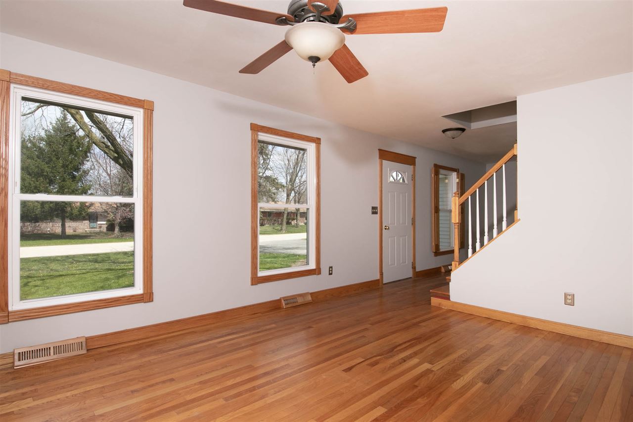 2893 Karr Road Belvidere, IL 61008 - Photo 8 of 25 a view of an empty room with wooden floor and a window