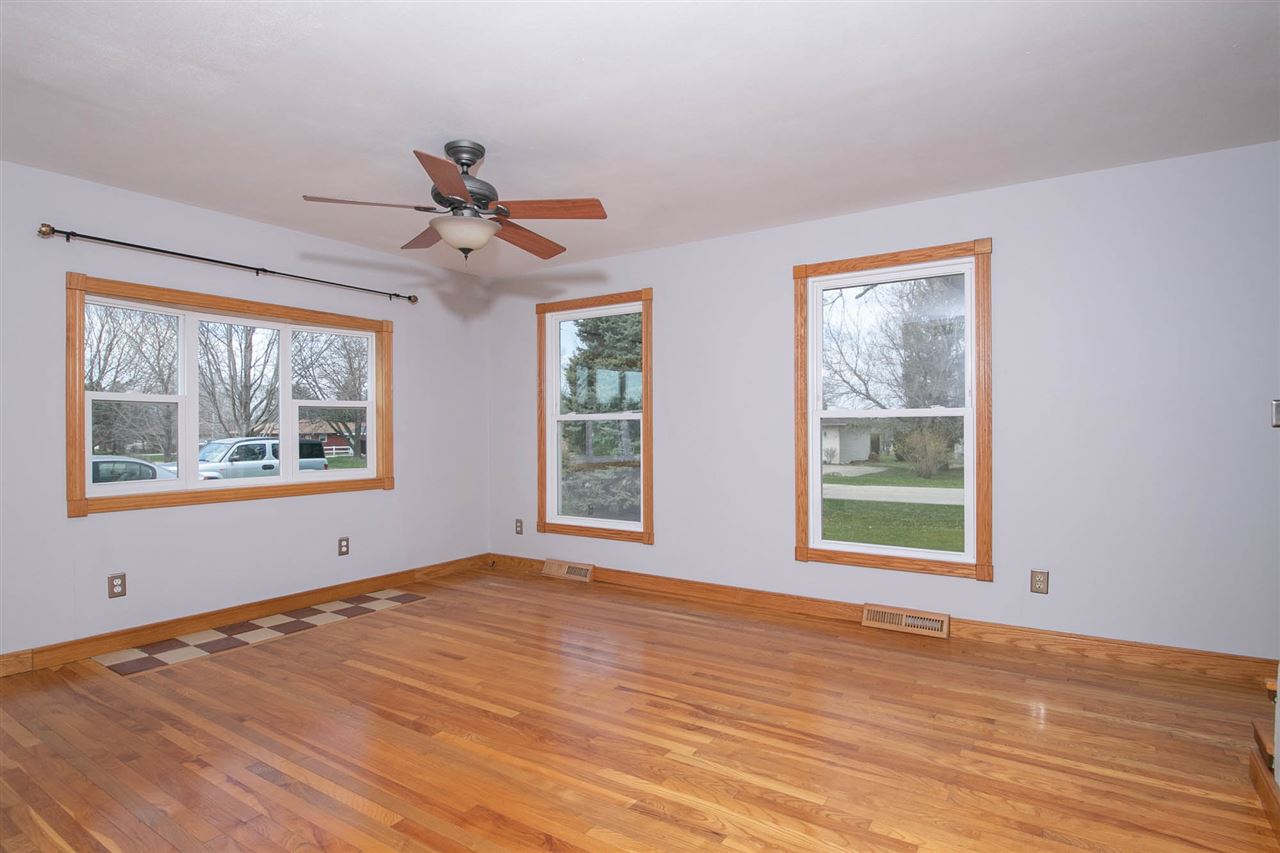 2893 Karr Road Belvidere, IL 61008 - Photo 10 of 25 a view of an empty room with wooden floor and a window