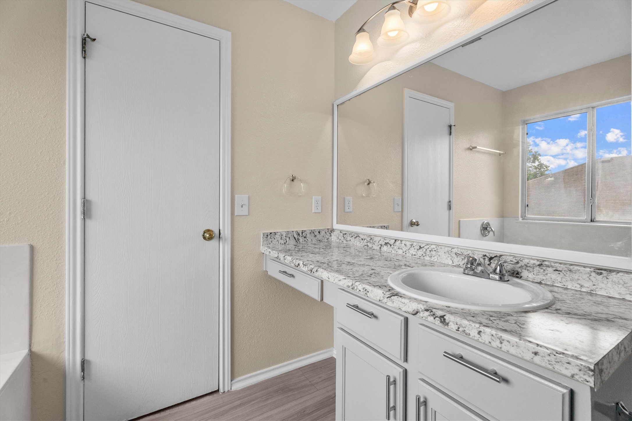 172 Discovery Kyle, TX 78640 - Photo 8 of 21 Bright vanity area with modern finishes, ample cabinet storage, and oversized mirror.
