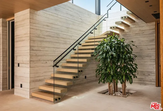 a hallway with two black and white walls