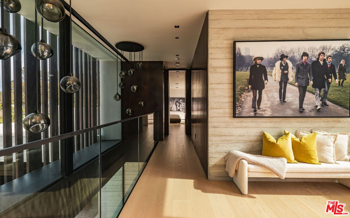 6889 Dume Drive Malibu, CA 90265 - Photo 14 of 41 a hallway with two black and white walls
