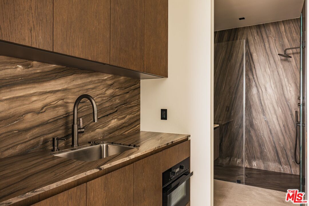 6889 Dume Drive Malibu, CA 90265 - Photo 31 of 41 a close view of sink and tap