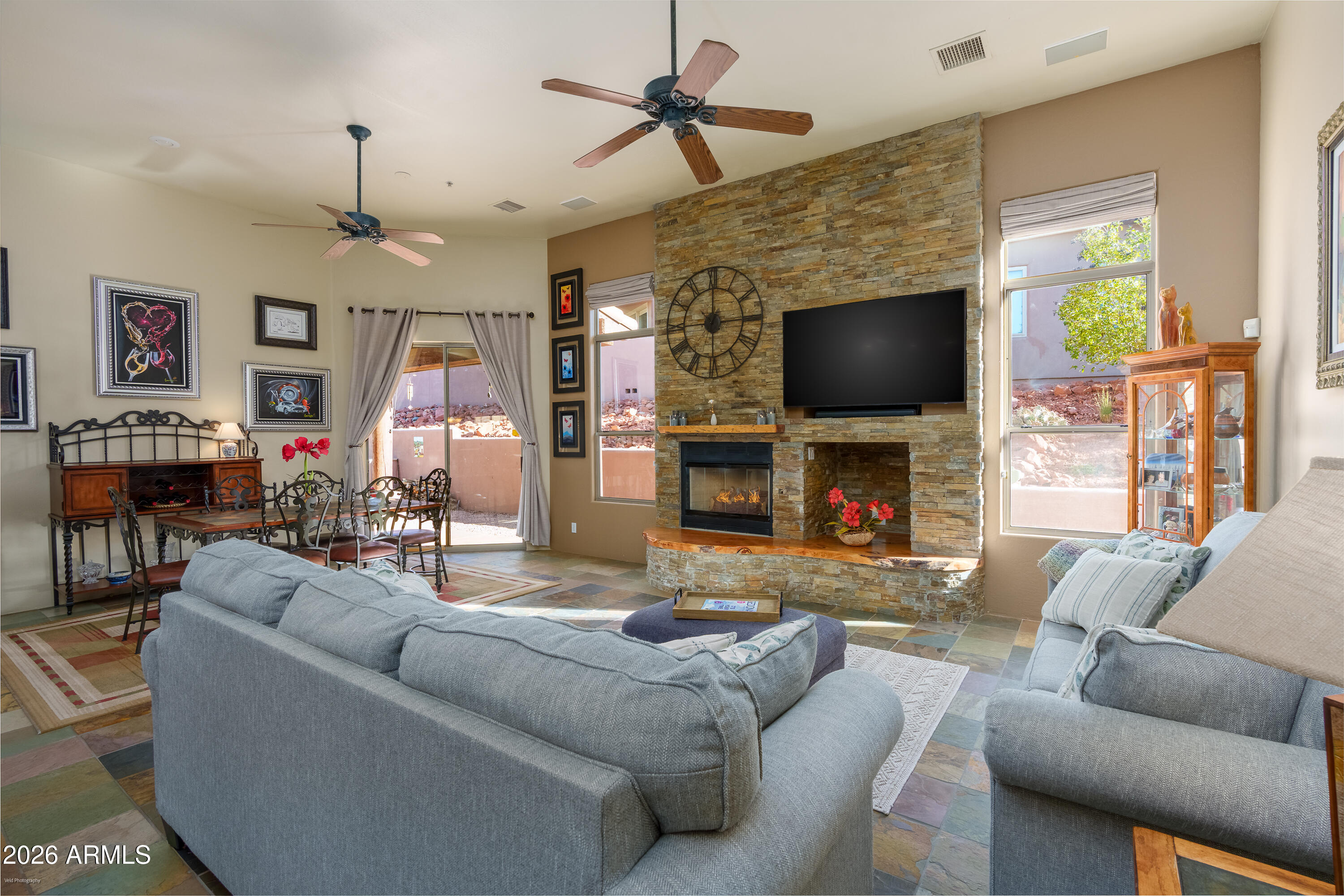 100 Rio Sinagua Sedona, AZ 86351 - Photo 1 of 43 a living room with fireplace furniture and a flat screen tv