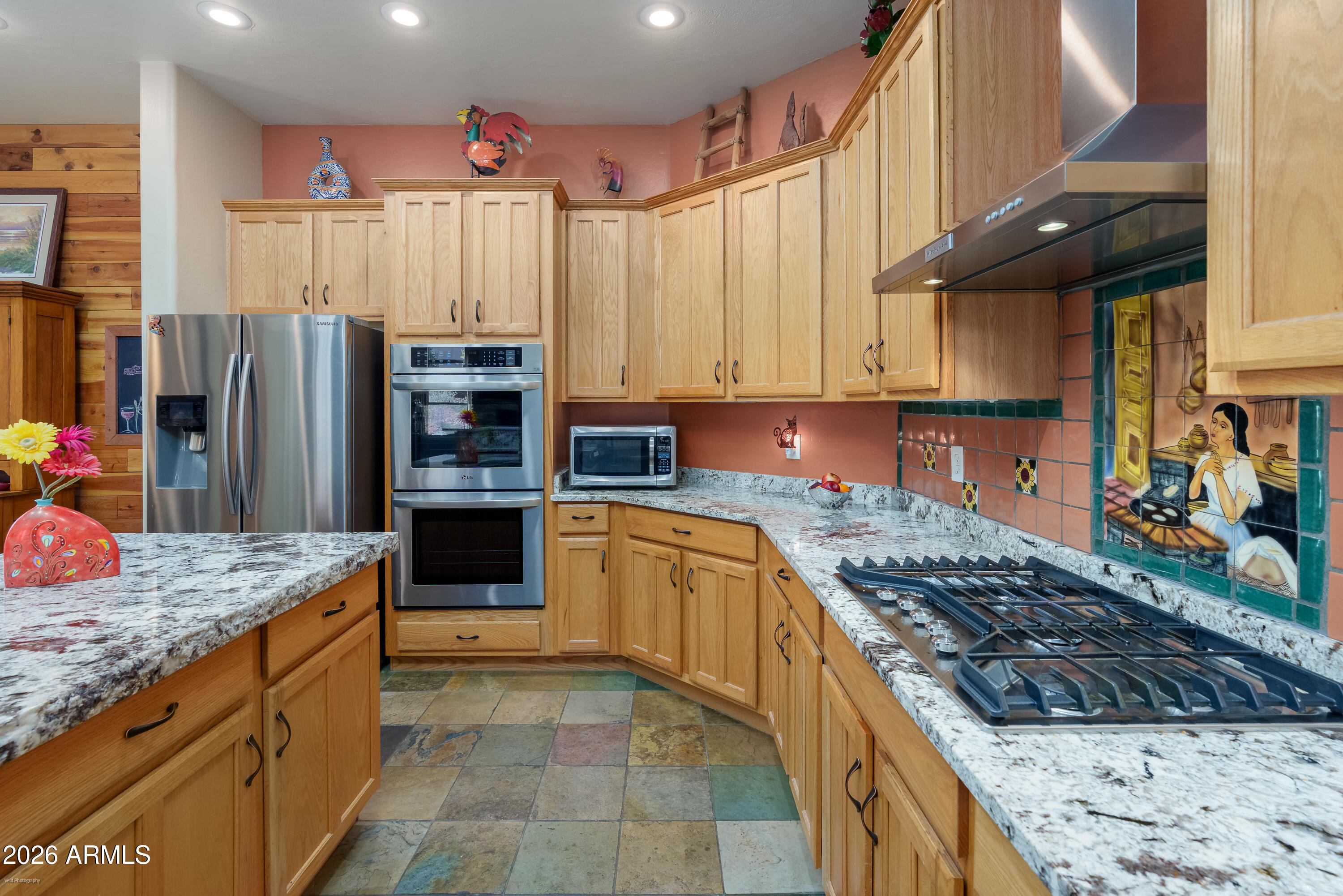 100 Rio Sinagua Sedona, AZ 86351 - Photo 18 of 43 a kitchen with stainless steel appliances granite countertop a stove refrigerator and cabinets