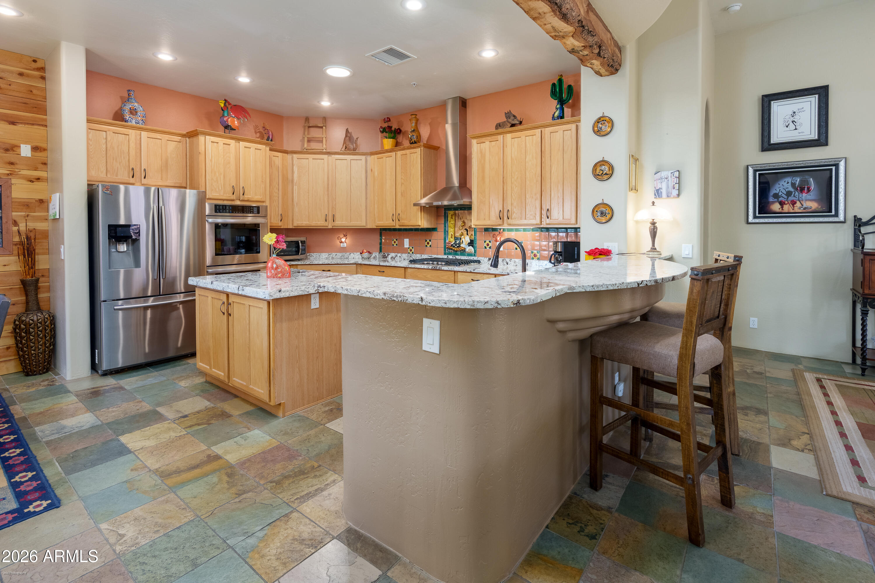 100 Rio Sinagua Sedona, AZ 86351 - Photo 19 of 43 a kitchen with refrigerator and chairs